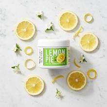 Load image into Gallery viewer, Lemon Pie scented coconut lotion with fresh lemon slices on white marble