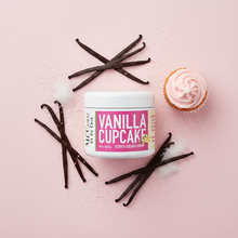 Load image into Gallery viewer, Vanilla Cupcake scented coconut lotion with vanilla beans and pink cupcake on pastel pink surface
